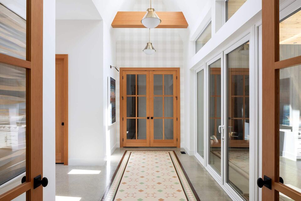 Main Cabin entry hallway with double doors and patterned tile runner