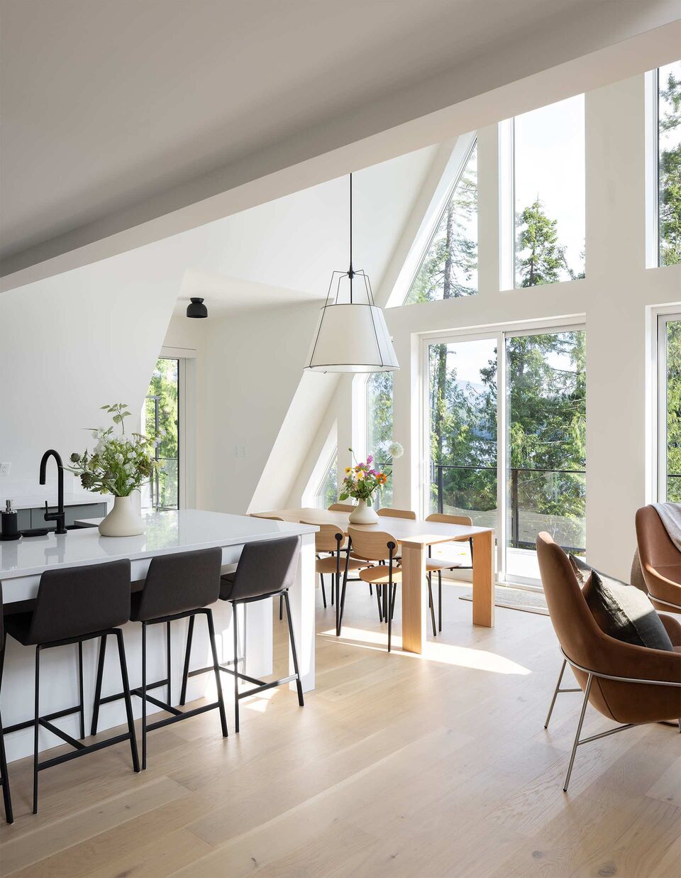 Cabin 2 kitchen island and dining table beneath the gable window wall