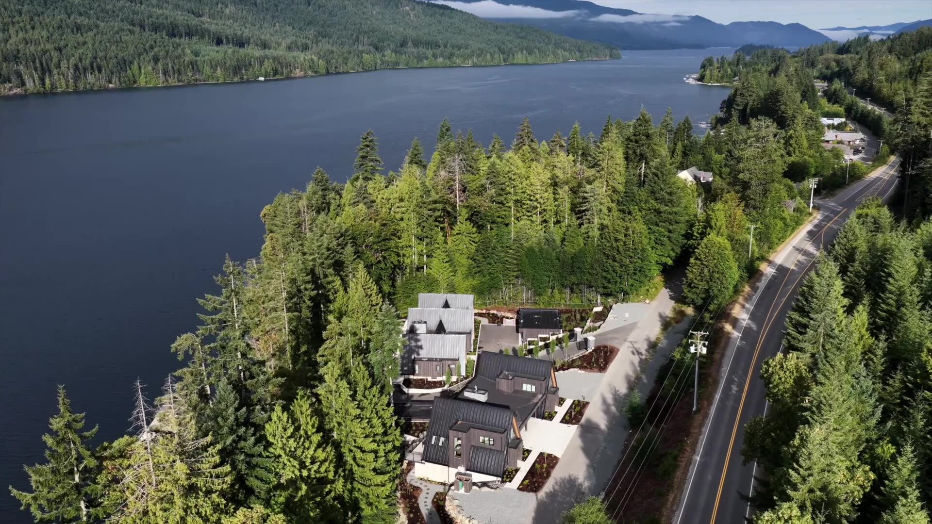 Guests arriving at an A-frame cabin with their bags